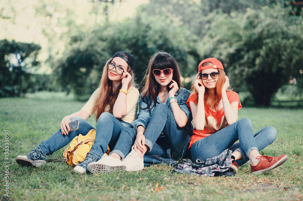 three young girls walking in the park Stock Photo | Adobe Stock