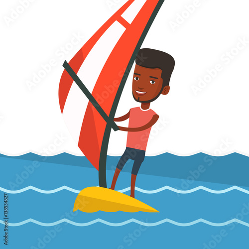 Young man windsurfing in the sea.