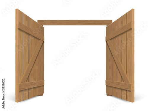 Old wooden massive opened gate. Double door with iron handles and hinges.