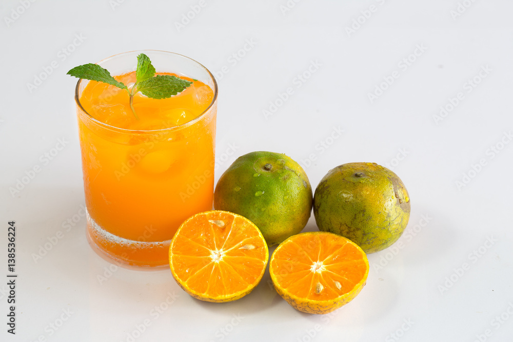 Fresh orange and juice in glass on white background Fresh orange and juice in glass on white background