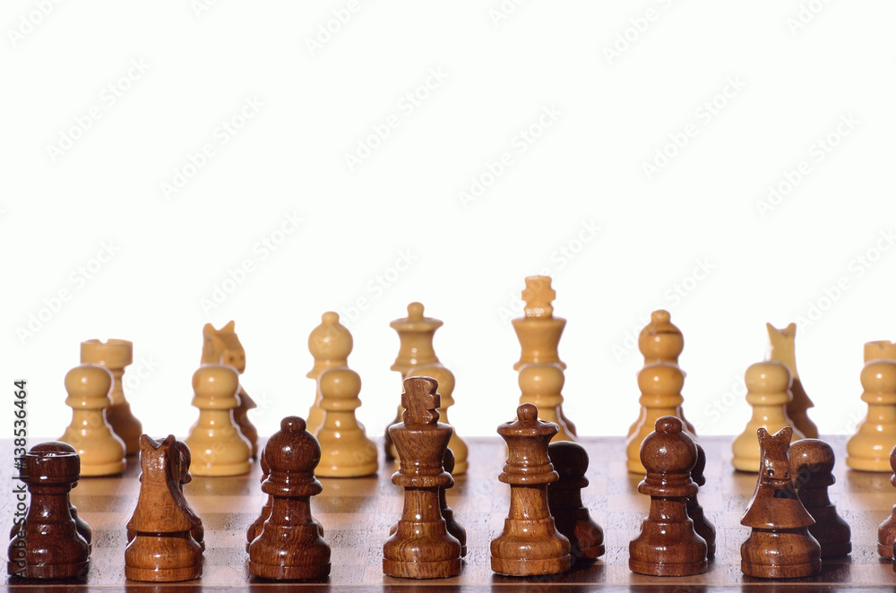 Wooden chess pieces against white for play Wooden chess pieces against white for play