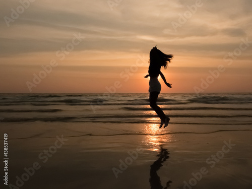 silhouette woman on the beach