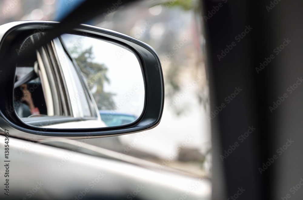 Rear view mirror reflecting car