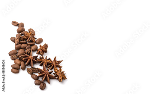 Coffee beans and spices scattered on white, food photo