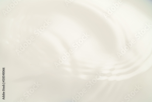 milk into bowl from above, closeup photo