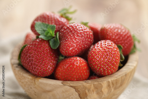 fresh strawberries in bowl on napkin on table  organic garden berries