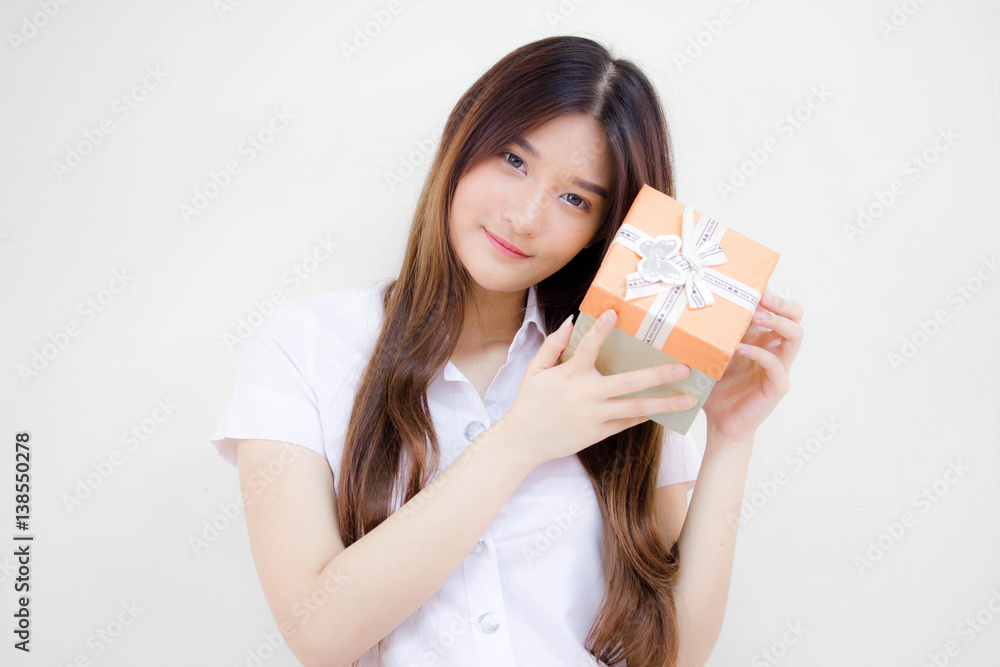 Portrait of thai adult beautiful girl hold gift box in hands Portrait of thai adult beautiful girl hold gift box in hands