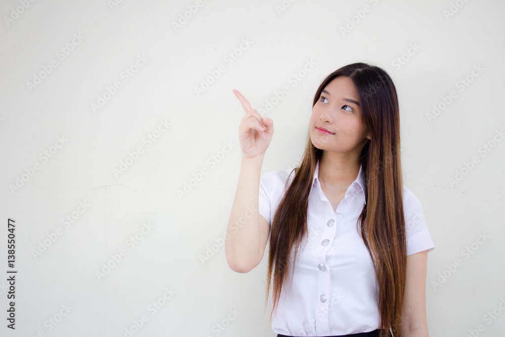 Portrait of thai adult student university uniform beautiful girl pointing Portrait of thai adult student university uniform beautiful girl pointing