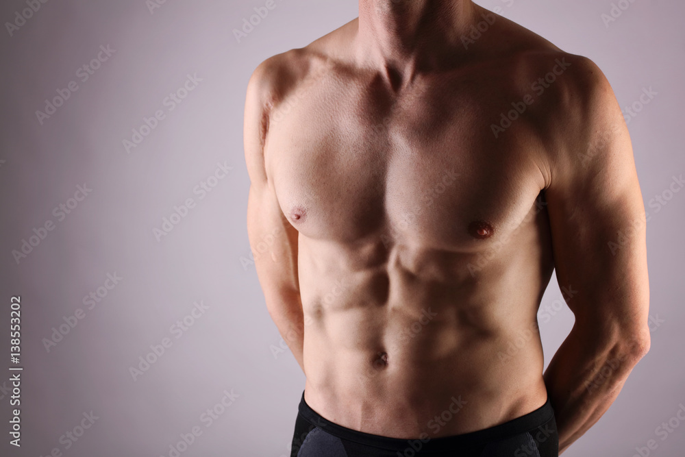 Close up of muscular male torso, chest and armpit hair removal. Male Waxing