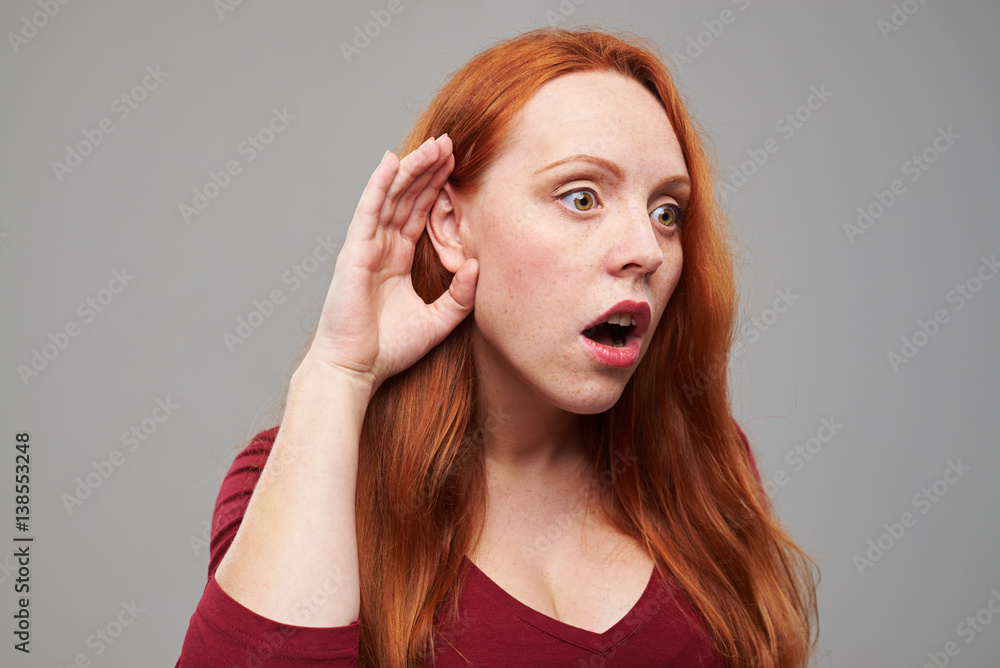 Shocked young lady overhearing something Shocked young lady overhearing something