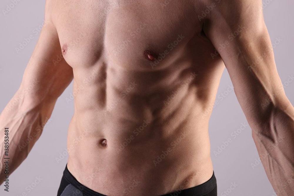 Close up of muscular male torso, chest and armpit hair removal. Male Waxing Close up of muscular male torso, chest and armpit hair removal. Male Waxing