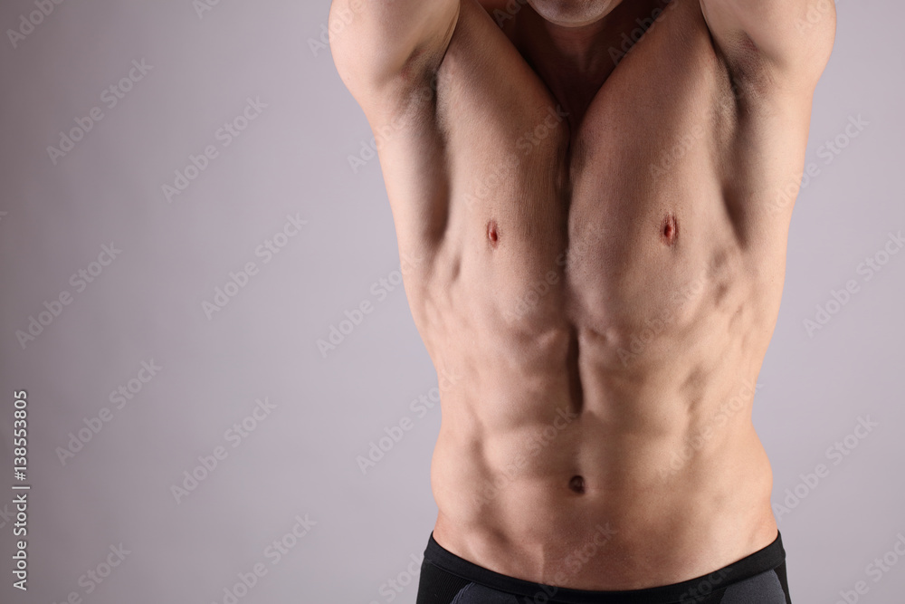 Close up of muscular male torso, chest and armpit hair removal. Male Waxing