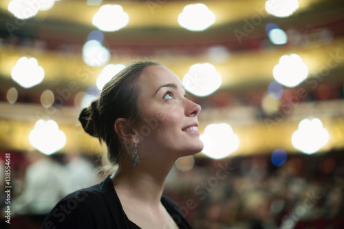 Woman in auditorium of teatre photo