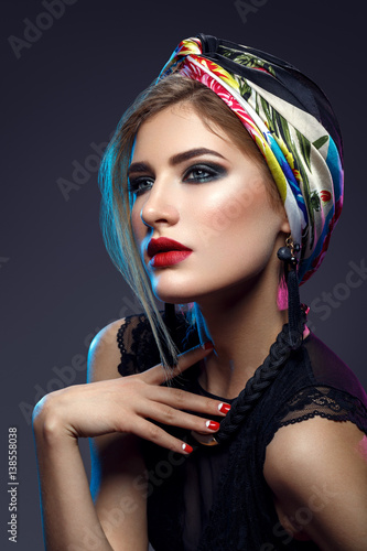 Beautiful girl with bright make-up and shawl on head © svetography