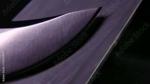Closeup of a knife and a sharpener. 4K UHD