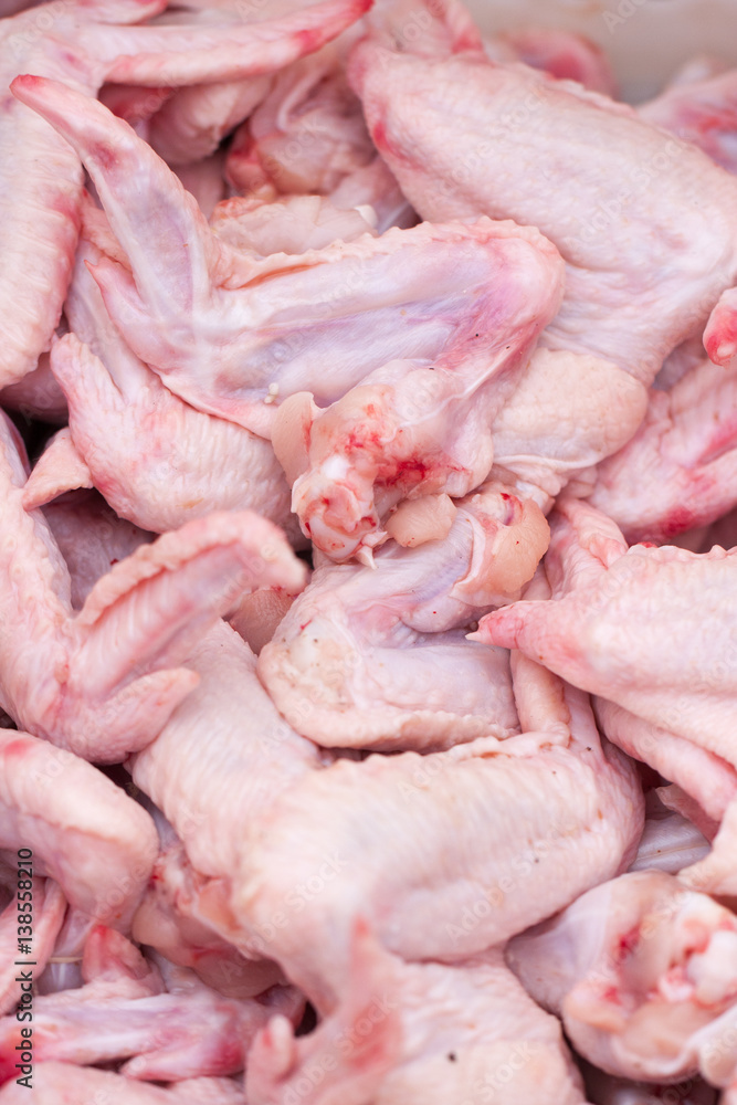 raw chicken wings sold in the market. Selective focus raw chicken wings sold in the market. Selective focus
