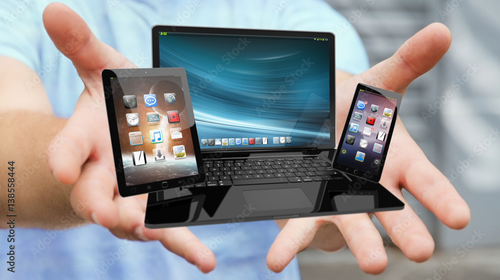 Businessman holding laptop phone and tablet in his hand 3D rendering