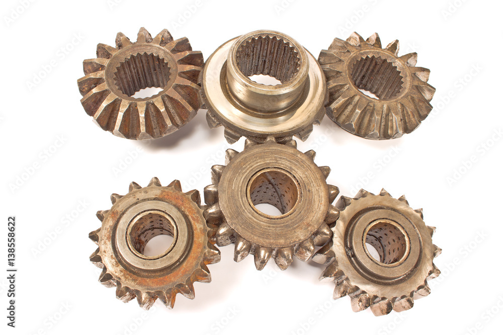 Old metal cogs isolated on white