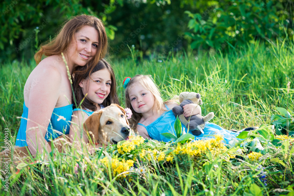 Obraz premium mother, two daughters and dog