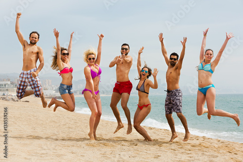 People jumping at beach