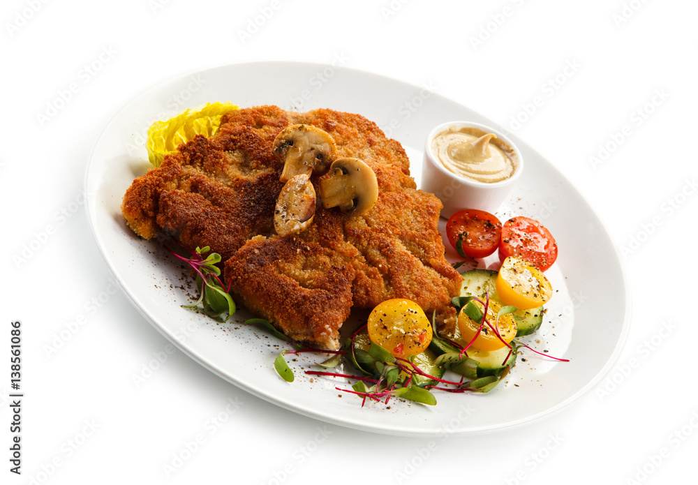 Fried pork chop, French fries and vegetables Fried pork chop, French fries and vegetables