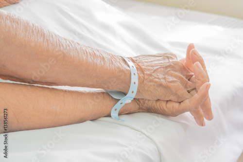 old Hand women on bed patient