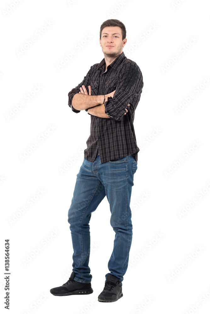 Smiling handsome man with rolled up shirt sleeves with crossed arms. Full body length portrait isolated over white background. Smiling handsome man with rolled up shirt sleeves with crossed arms. Full body length portrait isolated over white background.