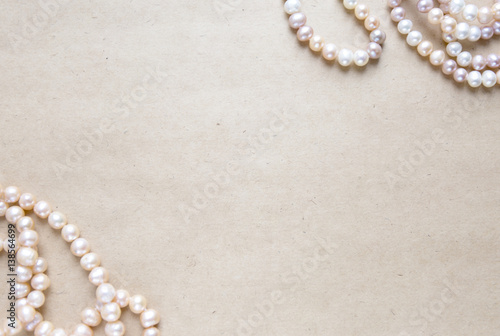 Blank craft background. Sheet of rough paper with rose pearls. Mock up for letter writing, creative work concept
