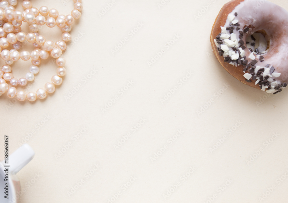 Blank craft background. Sheet of rough paper with rose pearls and donut. Mock up for letter writing, creative work concept Blank craft background. Sheet of rough paper with rose pearls and donut. Mock up for letter writing, creative work concept