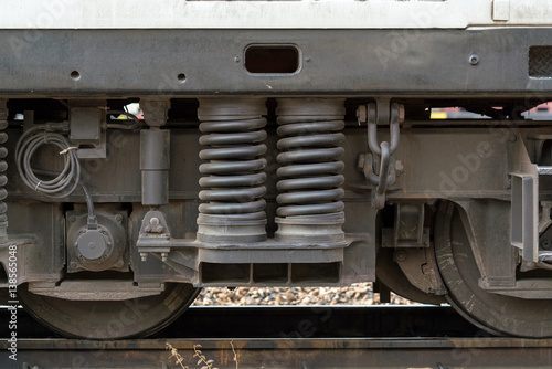 Close up detail of Suspension, shock absorber and wheels freight wagon - Diesel railcar