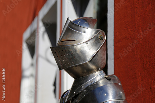 Knight armor / Body armor , designed to absorb and deflect slashing, bludgeoning and penetrating attacks by weapons.