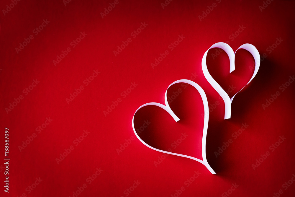 Paper hearts on a red background Paper hearts on a red background