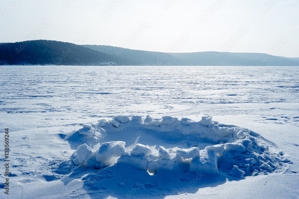 Hole for winter fishing on the lake Hole for winter fishing on the lake