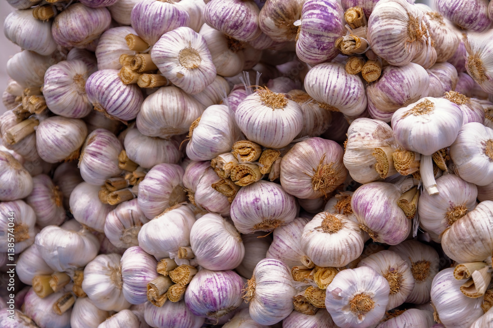 Fresh red garlic background, healthy food Fresh red garlic background, healthy food