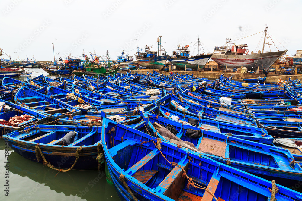 Small blue fishing boats in the harbor of Essaouira Small blue fishing boats in the harbor of Essaouira