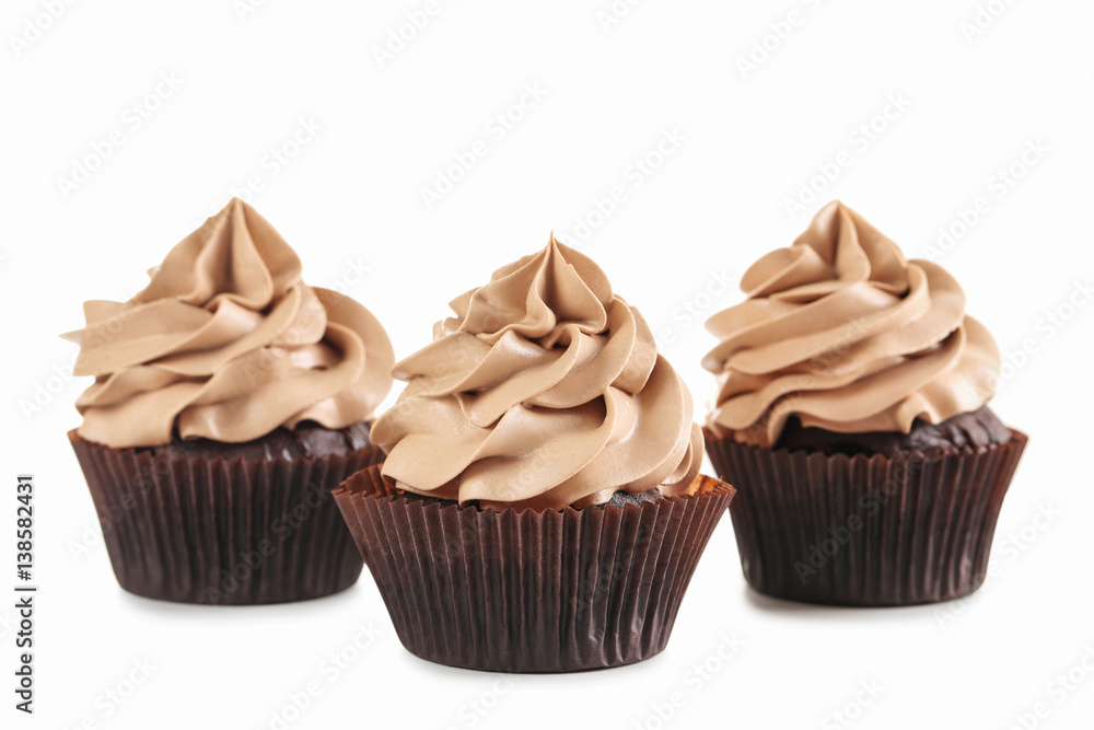 Tasty cupcakes isolated on a white Tasty cupcakes isolated on a white