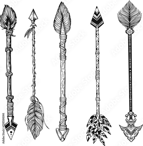 Tribal arrow set in ethnical pattern with feathers