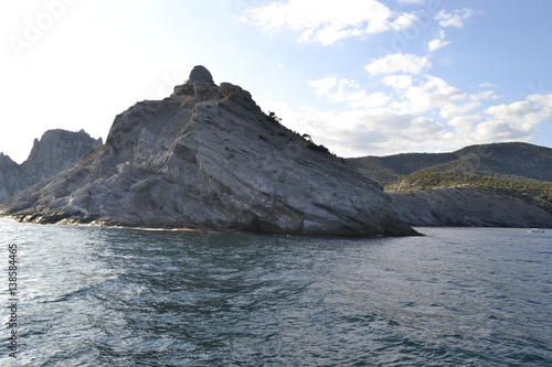 sea,beach,Crimea,Sudak,fortress,castle,Genoese fortress,Ukraine,mountains,cliffs,rocks, sea,sky,blue sky,sun,sea, stones,waves,spray,water,cat,gray cat,cat,smoothie,drink,glass,cherry,cocktail,Seagull