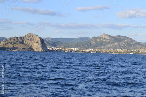 sea,beach,Crimea,Sudak,fortress,castle,Genoese fortress,Ukraine,mountains,cliffs,rocks, sea,sky,blue sky,sun,sea, stones,waves,spray,water,cat,gray cat,cat,smoothie,drink,glass,cherry,cocktail,Seagull