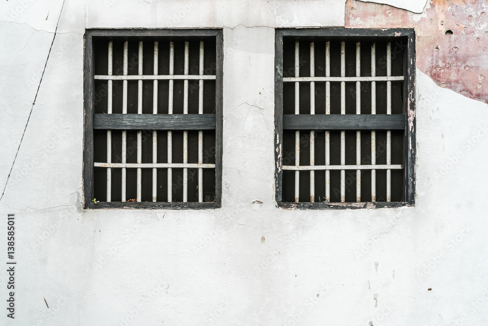 Jail's window on white wall