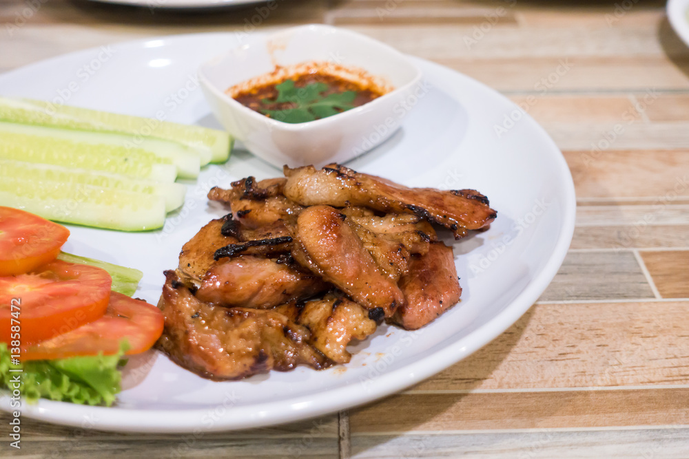 Grilled pork and sauce with salad vegetable .Thai traditional food.selective focus