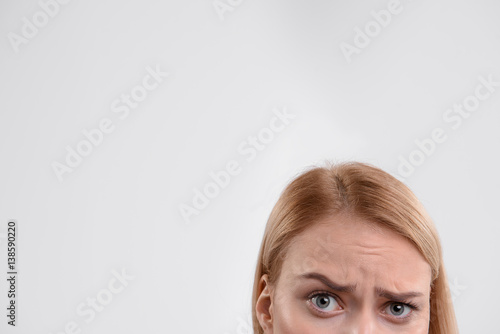 Sad young woman expressing negative emotions