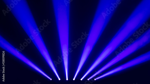 Blue stage spotlights with a smoke
