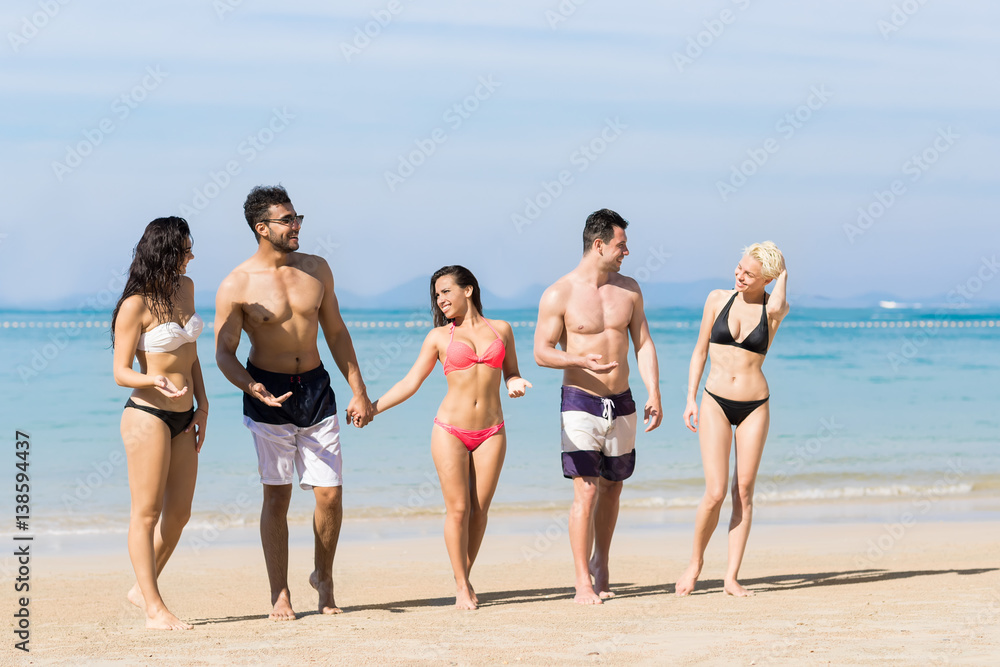 Young People Group On Beach Summer Vacation, Happy Smiling Friends Walking Seaside Sea Ocean Holiday Travel Young People Group On Beach Summer Vacation, Happy Smiling Friends Walking Seaside Sea Ocean Holiday Travel