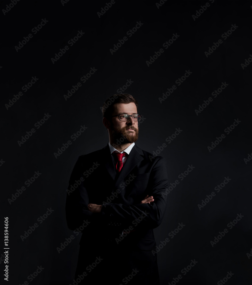 Businessman with beard. Black background with copyspace. Business and office concept.