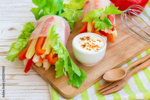 Spring roll with vegetables and white sour cream souce photo