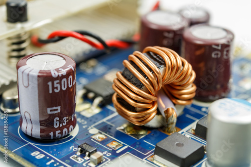 Transformer on a ferrite ring on the circuit board closeup