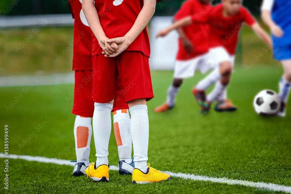 Obraz premium Youth Football Soccer Background. Football Soccer Match for Children. Kids Playing Soccer Game Tournament. Boys Running and Kicking Football. Youth Soccer Footballers Competition