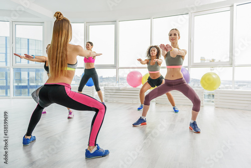 Sportive taut girls in gym