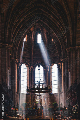 Beams of light pour in through chapel windows